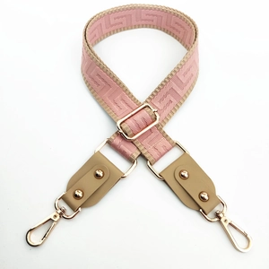 Adjustable wide replacement strap with pink and beige geometric weaving and gold hooks