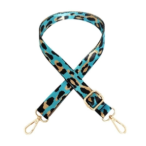 Close-up of blue leopard print wide bag strap with adjustable gold metal buckle