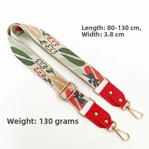Detailed view of bohemian floral embroidery bag strap with gold metal hooks and dimensions