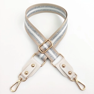 Adjustable wide shoulder strap with silver metallic stripes and gold metal buckles