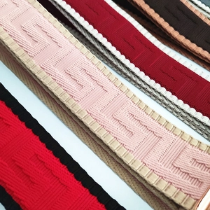 Close-up of adjustable woven shoulder straps with geometric patterns for handbags