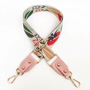 Adjustable thickened floral jacquard bag strap with pink leather ends and gold metal clips