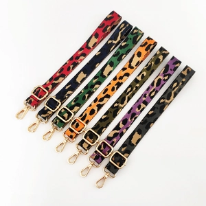 Detail of assorted colorful leopard print replacement bag straps with gold metal clasps