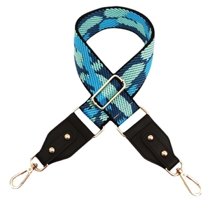 Adjustable wide fabric bag strap with blue color-block pattern and gold metal hooks