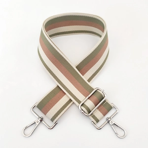 Detail of 5cm wide striped cotton strap with silver metal swivel hooks and buckle