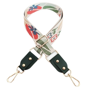 Adjustable floral jacquard guitar strap for handbags with leather ends and gold hardware