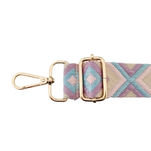 Detail of colorful geometric diamond woven strap with light gold metal lobster clasp