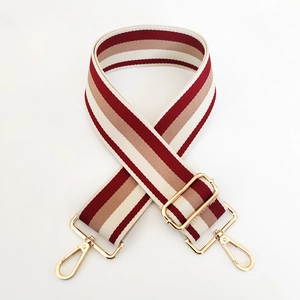 Detail of 5cm thickened striped strap with golden adjustable buckles and swivel hooks