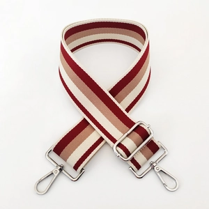 Close-up of 5cm wide striped canvas bag strap with durable silver metal swivel hooks