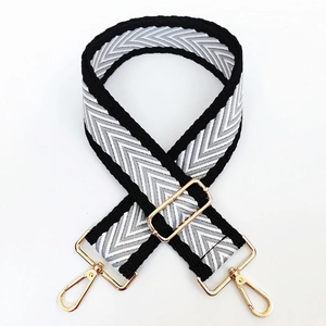 Detail of adjustable 5cm wide crossbody strap with black and white chevron pattern