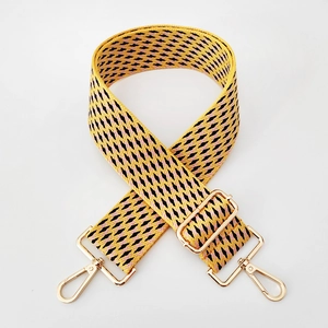 Detail of 5cm wide colorful geometric jacquard woven strap with gold metal buckles