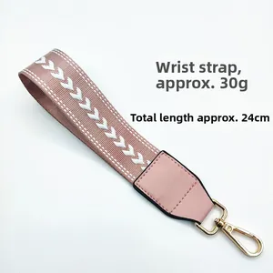 Short pink and white woven wrist strap with PU leather and gold spring buckle