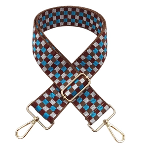 Adjustable wide woven shoulder strap with blue and brown checkered pattern and gold buckles
