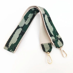Detail of green camouflage jacquard strap with premium gold swivel lobster clasps