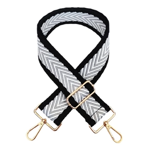 5cm wide adjustable shoulder strap with black and white arrow pattern and gold hooks