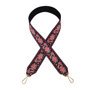 Ethnic style embroidered wide bag strap with colorful floral patterns and gold metal clasps