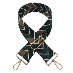 Detail of adjustable colorful jacquard guitar strap with vintage green herringbone pattern