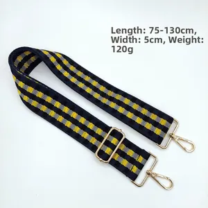 Detail of 5cm wide checkered nylon bag strap with gold metal hooks and 75-130cm length