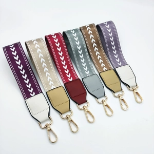 Set of six colorful woven wristlet straps with arrow patterns and gold lobster clasps