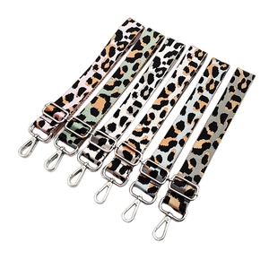 Macro detail of high-density jacquard leopard print straps with silver metal hardware