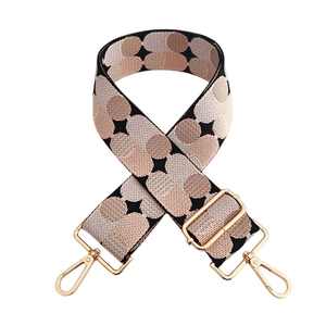 Detail of 5cm jacquard woven strap with dots pattern and gold lobster claw clasps