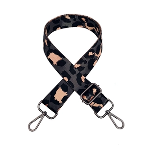Macro shot of leopard print replacement strap with dark grey and pink jacquard pattern