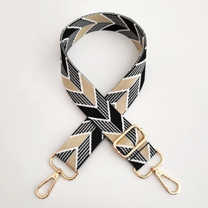 Adjustable wide jacquard bag strap with geometric chevron pattern and gold hardware