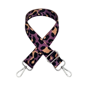 Detail of adjustable purple leopard print nylon strap with silver metal lobster clasps