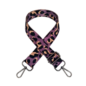 Detail of purple leopard jacquard nylon bag strap with adjustable gunmetal swivel hooks
