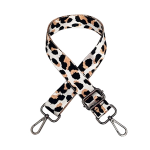 Detail of leopard jacquard wide shoulder strap with adjustable gunmetal buckle and clips