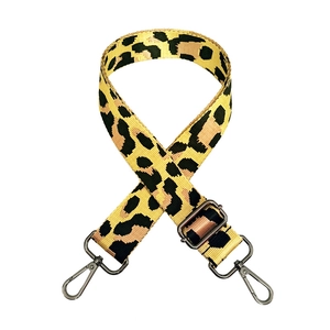 Detail of adjustable leopard print jacquard strap with durable metal swivel carabiners