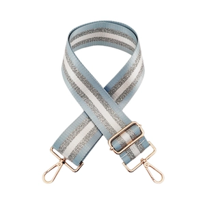 Detail of adjustable 5cm wide blue and silver striped bag strap with rose gold metal hooks
