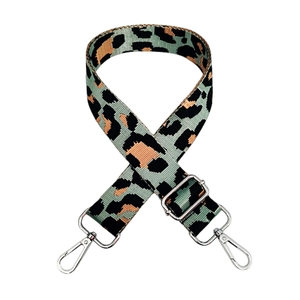 Detail of adjustable leopard print strap with silver lobster clasps and metal buckle