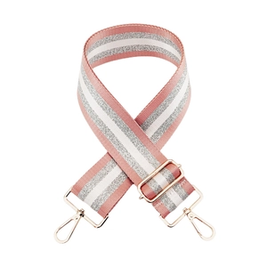 Detail of pink and silver glitter striped nylon strap with gold metal swivel hooks