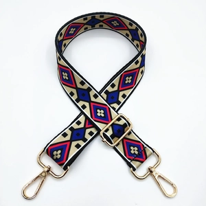 Adjustable wide ethnic style handbag strap with red blue geometric patterns and gold clips