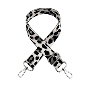 Detail of adjustable leopard print jacquard strap with silver metal swivel hooks