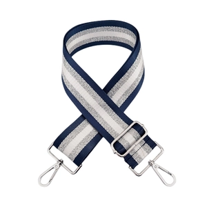 Detail of adjustable nylon bag strap with navy and silver glitter stripes and metal hooks