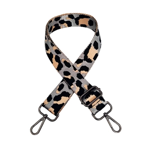 Detail of adjustable leopard print jacquard strap with dark gunmetal swivel hooks
