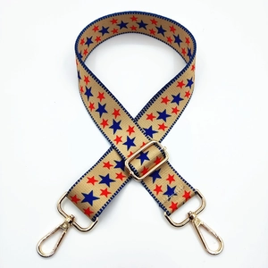 Adjustable wide shoulder strap with red and blue star patterns and golden metal clips