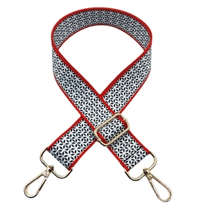 Ethnic style wide shoulder strap with red and white geometric star patterns and gold hooks