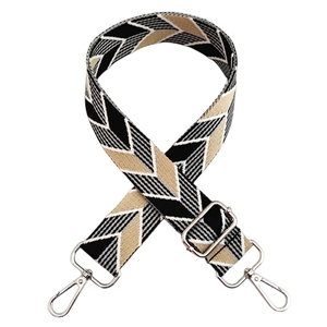 Detail of adjustable wide canvas shoulder strap with vintage black and white geometric pattern