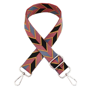 Detail of colorful chevron embroidered canvas bag strap with silver metal swivel hooks