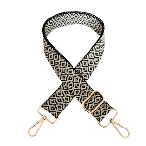 Adjustable wide shoulder strap with black and white diamond pattern and gold metal hooks