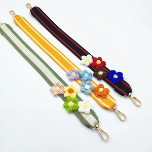 Detailed view of handmade colorful crochet flower straps with golden lobster clasps
