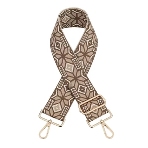 Close-up of ethnic jacquard purse strap with 5cm width and golden metal hardware