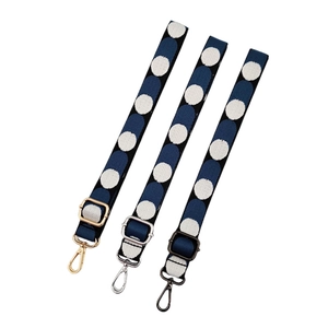 Adjustable 2.5cm wide canvas shoulder strap with white polka dots and metal swivel hooks