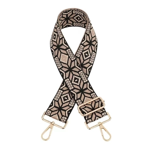 Close-up of vintage jacquard strap with pink geometric patterns and gold metal hooks