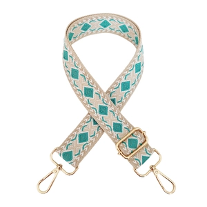 Adjustable wide jacquard bag strap with teal diamond pattern and gold metal hardware