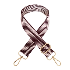 Adjustable wide shoulder strap with red and cream herringbone pattern and gold metal hooks