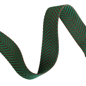 Close-up of thick green and brown herringbone woven wide shoulder strap for bags